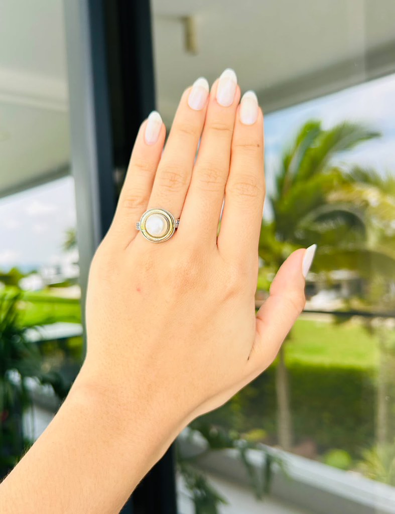 Sterling silver ring with sapphire stone on hand